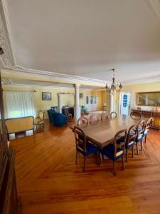 a large dining room with a table and chairs at West Gold in Praia de Mira