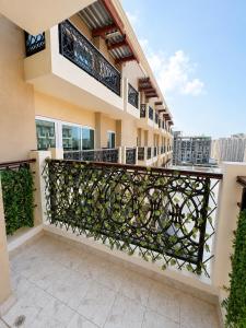 a balcony of a house with a wrought iron fence at Livora Elite in Ghaziabad