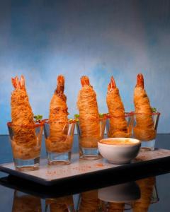a bunch of food in glasses on a table at Hotel Park Elanza Chennai in Chennai