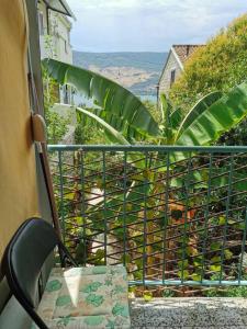 a balcony with a table and a view of the ocean at Apartman Ex-Yu in Španjola