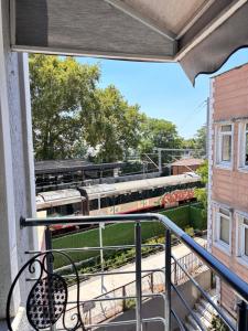 a balcony with a train on the tracks at Hisar Çeşme Hotel in Istanbul