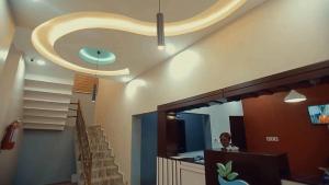 a room with a staircase with a circular ceiling at Riverleaf Hotels and Suites in Asaba