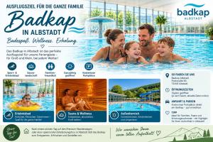 a catalogue of a swimming pool with a family in the water at Panoramablick mit Premium-Wanderwegen vor der Haustür in Albstadt