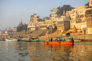 a group of people on a boat in the water at Residency Trilok in Varanasi