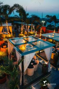 a patio with a table with lights and plants at Hotel Park Elanza Chennai in Chennai