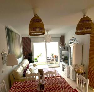 a living room with a couch and a table at Casa Maldo in Tarifa