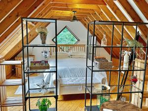 a bedroom with a bed in a attic at The Loft House in Canford Magna