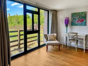 a room with a desk and a chair and a window at Barn Owl Cottage - Uk48510 in Kirk Hammerton
