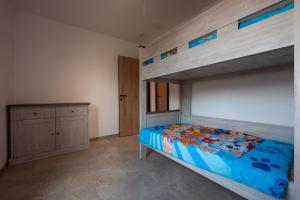 a bedroom with a bunk bed and a cabinet at Klein Lauw 39 in Tongeren