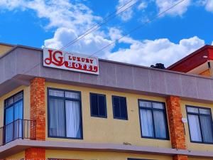 a usury hotel sign on top of a building at JG Luxury Hotel in Dodoma
