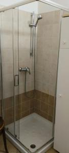 a shower with a glass door in a bathroom at Al Volto in Roncegno +64 photos