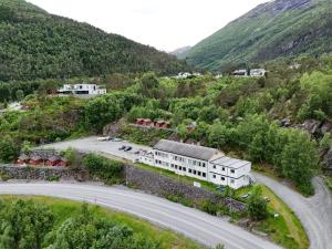 an aerial view of a building in the mountains at Hellesylt Hostel in Hellesylt