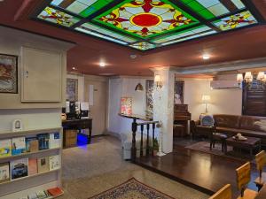 a living room with a stained glass ceiling at Incheon 레토하우스 in Incheon
