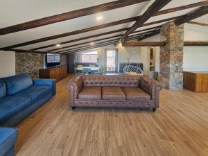 a living room with a couch and a table at Kraska nisa in Komen