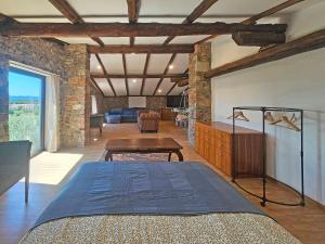 a bedroom with a bed and a table in a room at Kraska nisa in Komen