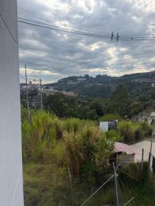 a group of birds sitting on a power line at Descanso Ideal in Manizales
