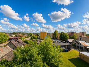 a view of a city with buildings and trees at Smiltelė apartamentai in Varėna