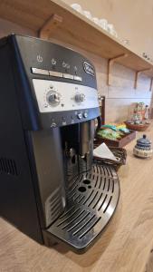 a coffee maker sitting on top of a counter at Agroturystyka Klekusiowo in Bolesławiec