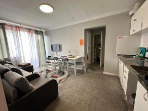 a living room with a couch and a table at InCentrum Pańska 3 in Warsaw