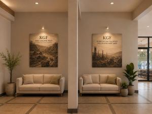 a lobby with two couches and posters on the wall at The Silvan Villa Resort in Bangārapet