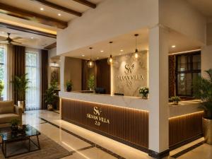 a lobby of a hotel with a reception desk at The Silvan Villa Resort in Bangārapet