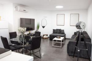 a living room with a couch and a table at סוויטת רגעים Regaim צימר בוטיק בגליל העליון in Sede Eli‘ezer