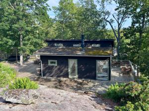 a small house in the middle of the woods at The Archipelago Hideaway in Vaxholm