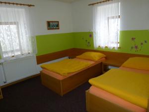 Postel nebo postele na pokoji v ubytování Hotel Pelikan