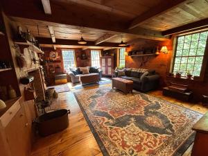 a large living room with a rug on the floor at Old Deerfield Treasure! in Deerfield
