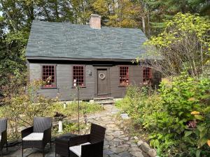 a small house in the middle of a garden at Old Deerfield Treasure! in Deerfield