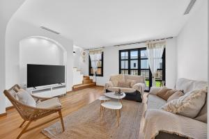 a living room with a couch and a tv at Luna in San Blas in San Miguel de Abona