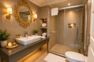a bathroom with a sink and a shower at REAL KiNG RESiDENCE in Trabzon +29 photos