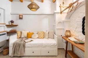 a bedroom with a bed with pillows on it at Boriadon Rustic Countryside Homes in Naxos Chora