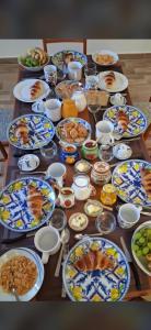 a table full of plates of food on a table at Il piccolo artista b&b in Naso