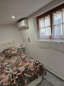 a bedroom with a bed and a window at Joli rez de jardin in La Seyne-sur-Mer +29 photos