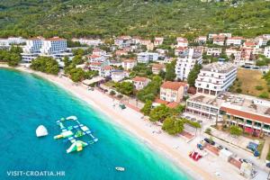 an aerial view of a beach with a boat in the water at Apartments Villa Nikola- one minute to the beach in Gradac