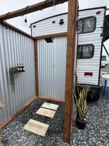 an rv garage with awning next to it at Sin Ancla in Boqueron