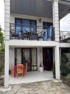 a table and chairs in front of a house at temo lali in Tbilisi City