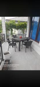 a black table and chairs on a patio at temo lali in Tbilisi City +12 photos