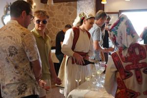 a group of people standing around a table with wine glasses at Kruja Albergo Diffuso , Inside Kruja Castle in Krujë
