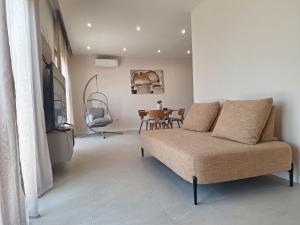 a living room with a couch and a table at 4 stars - apartments Senj in Senj +36 photos