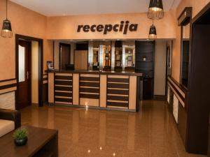 a room with a store with a kitchen with a counter at Semberski Salaš Intergaj Hotel in Bijeljina +62 photos