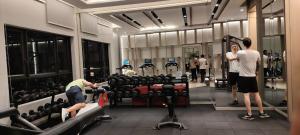 a man working out in a gym with a woman at Agile Residence By Arshad in Kuala Lumpur