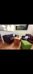a living room with a couch and a table at FeWo Hirsch in Todtmoos