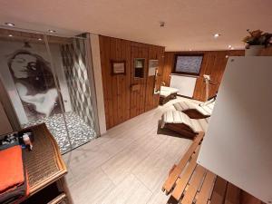 a room with wooden walls and wooden floors at Frickenblick Lounge & Sauna in Farchant