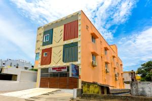a building with colorful windows on the side of it at B2N Hotels Near Sri Ramachandra Hospital Porur in Chennai
