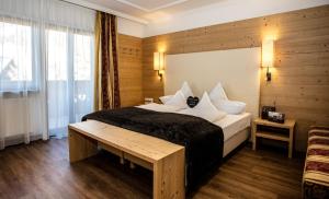 Postel nebo postele na pokoji v ubytování Hotel Dorfer Alpine&Charming