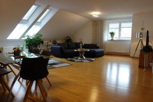 a living room with a couch and a table at Ferienwohnung Solling Niedersachsen in Uslar