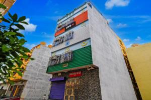 a building with colorful doors on the side of it at Hotel O Elegant Stay CDA in Cuttack +21 photos