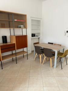 a dining room with a table and chairs at Le Cepyo in Saint-Quentin +9 photos